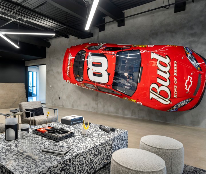 table inside office with racing car picture on the wall
